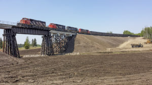 First train passing over completed bridge on May 15, 2016.